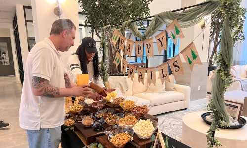 residents picking foods and snacks at a table