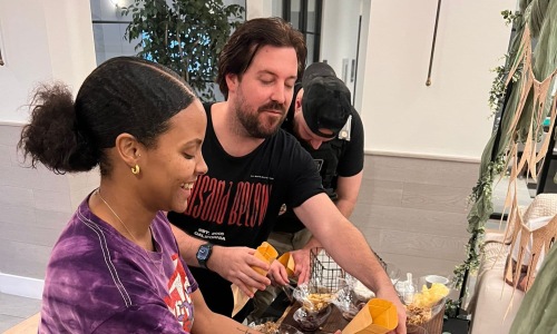 residents picking food at a table
