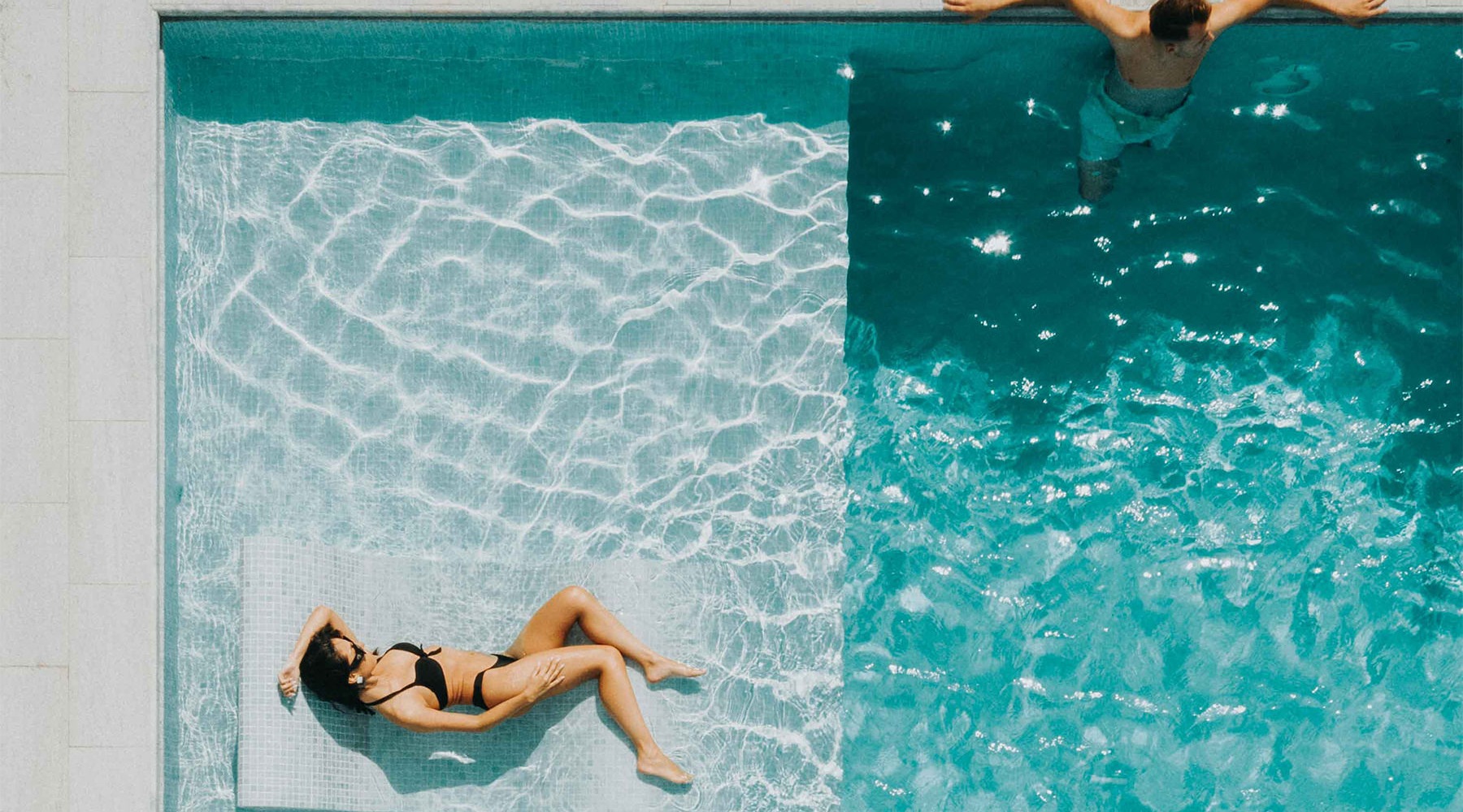 Swimming pool couple in pool