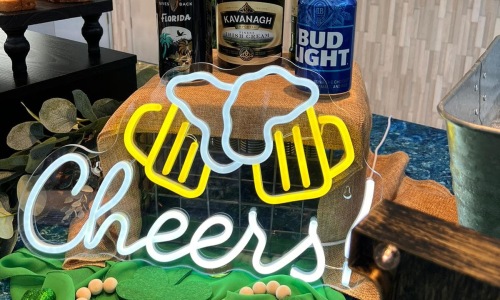 neon signage showing a cheers message